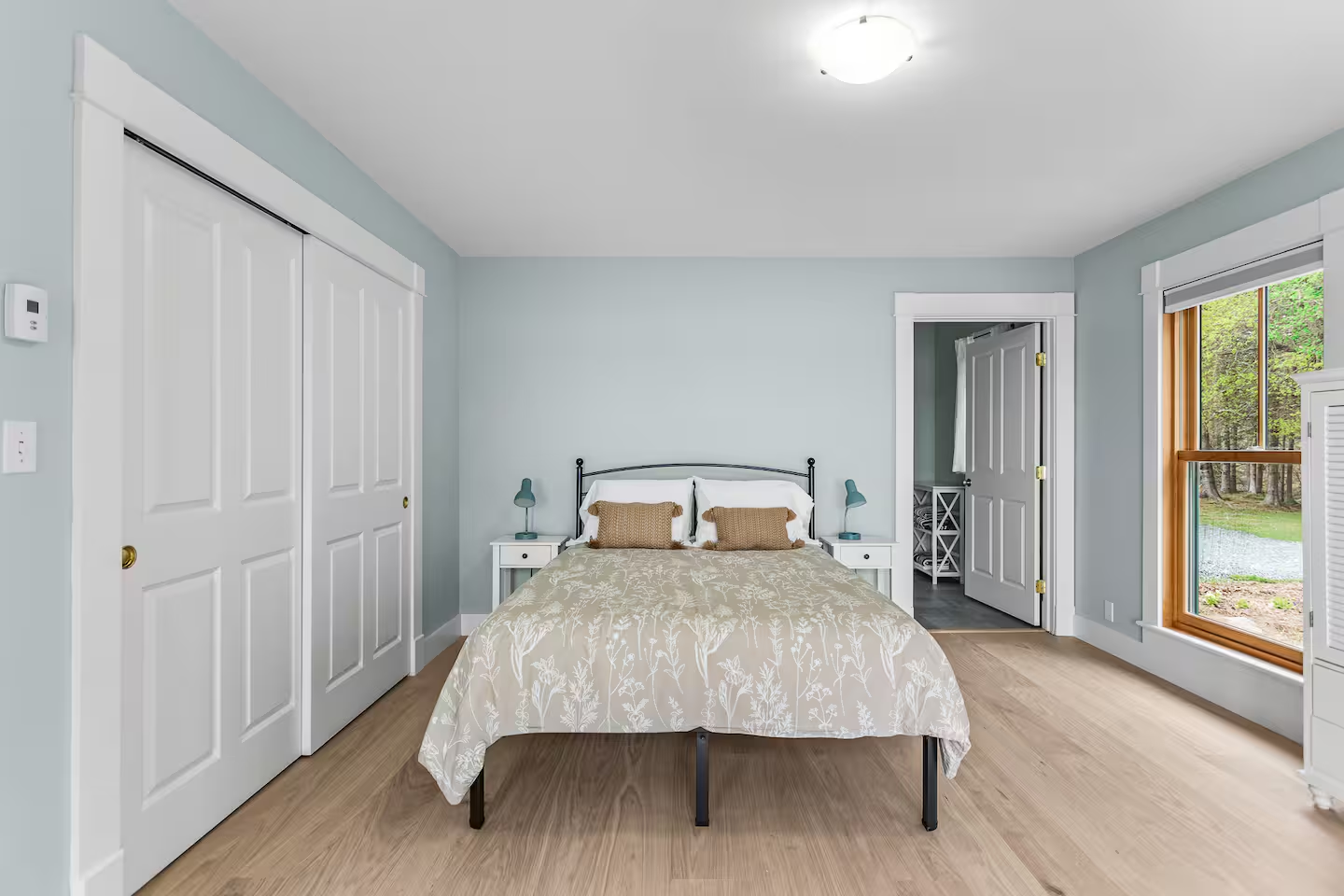 Coastal bedroom with soft blue walls
