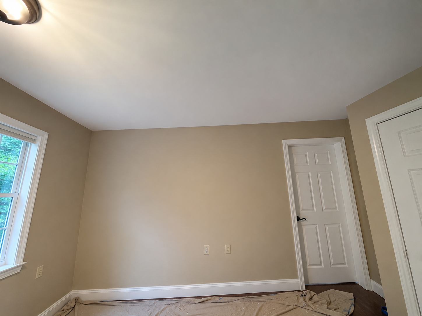 Finished room with smooth repaired walls and ceiling
