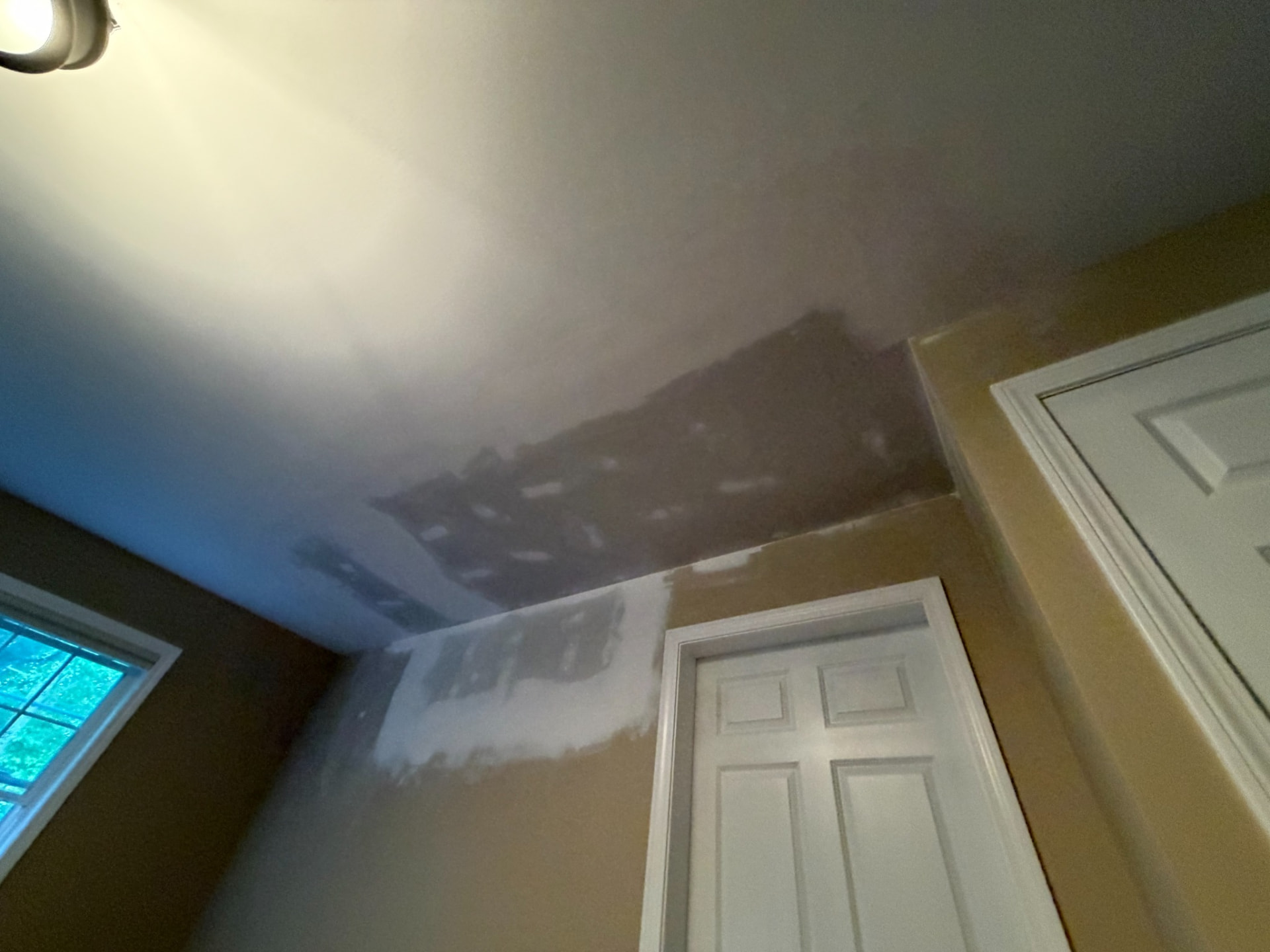 New drywall installed, taped, and mudded