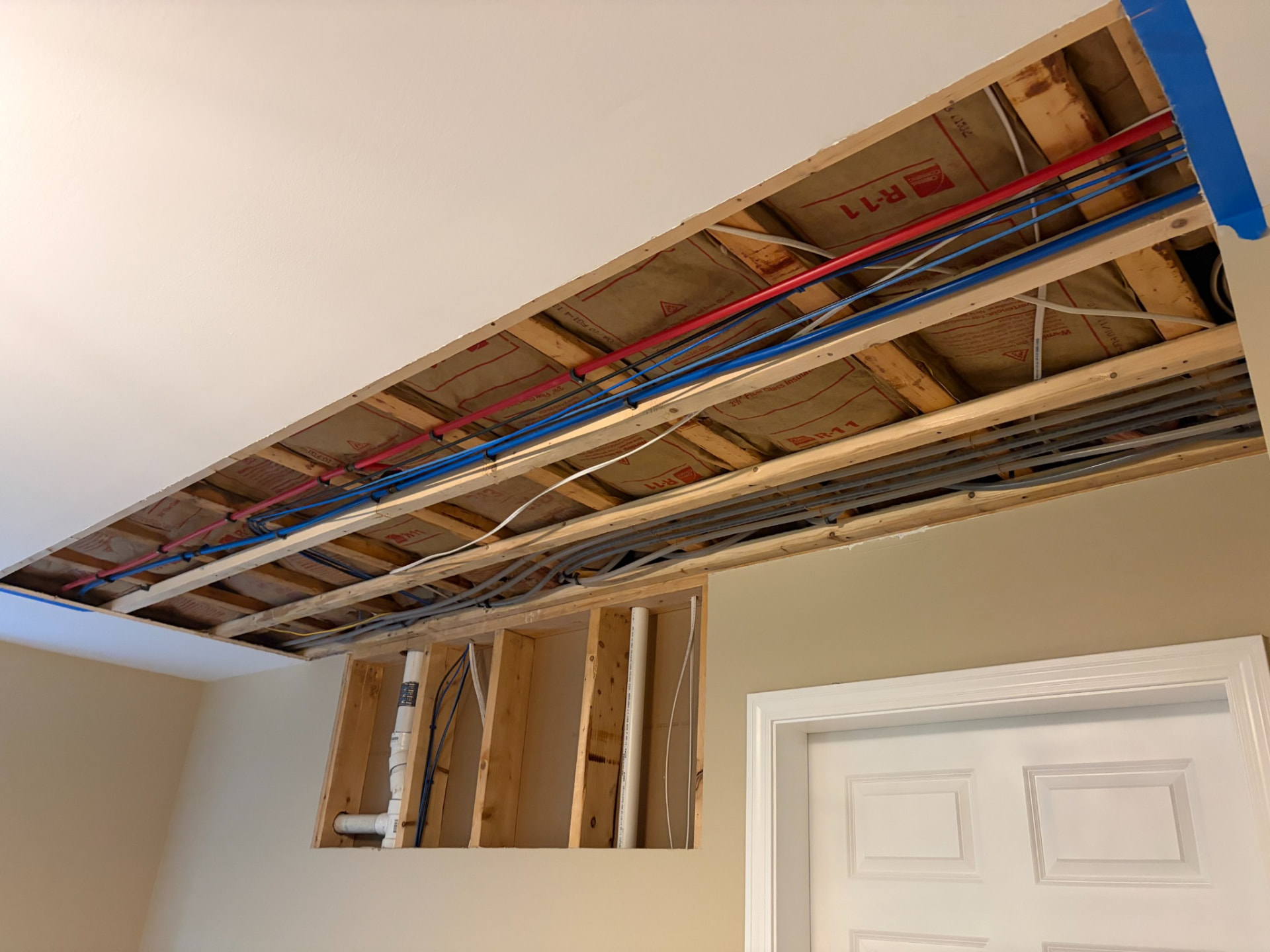 Exposed framing and repair detail in ceiling